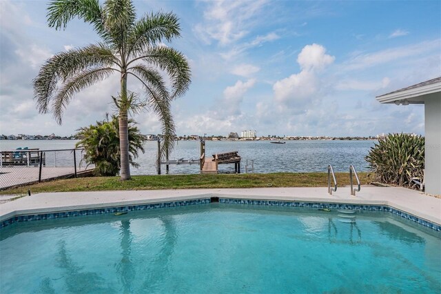 7092 S Shore Dr S, Saint Petersburg, FL 33707 - swimming pool featuring a water view, a dock, and fence
