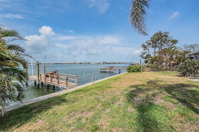 7092 S Shore Dr S, Saint Petersburg, FL 33707 - dock area featuring a water view and a lawn