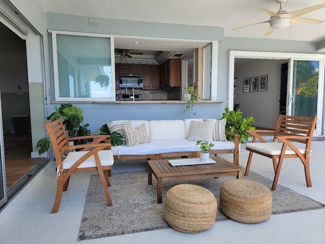 7092 S Shore Dr S, Saint Petersburg, FL 33707 - living room with ceiling fan and healthy amount of natural light