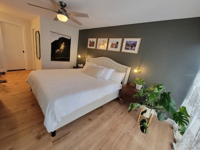 7092 S Shore Dr S, Saint Petersburg, FL 33707 - bedroom with light wood-style floors and ceiling fan