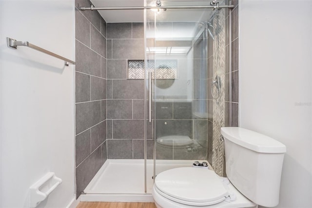 7092 S Shore Dr S, Saint Petersburg, FL 33707 - bathroom featuring toilet and a shower stall