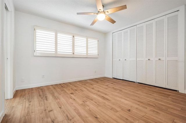 7092 S Shore Dr S, Saint Petersburg, FL 33707 - unfurnished bedroom featuring light wood-style floors, baseboards, and a ceiling fan