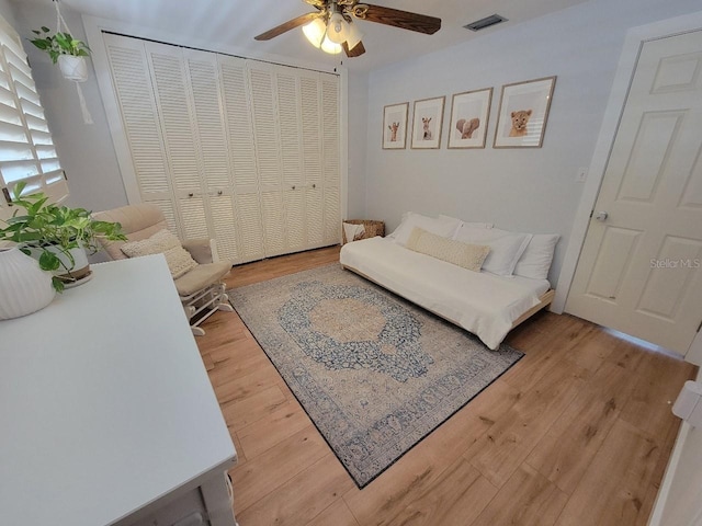 7092 S Shore Dr S, Saint Petersburg, FL 33707 - living room with a ceiling fan and wood finished floors
