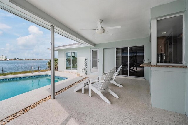 7092 S Shore Dr S, Saint Petersburg, FL 33707 - swimming pool with a ceiling fan, a water view, and a patio