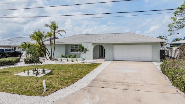 7092 S Shore Dr S, Saint Petersburg, FL 33707 - single story home with stucco siding, an attached garage, driveway, and a shingled roof