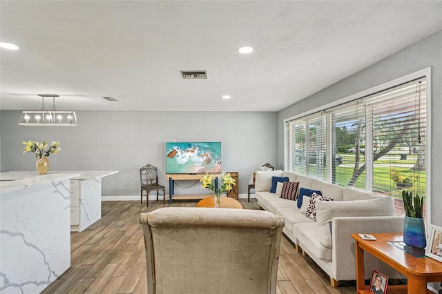 6010 Bayou Grande Blvd NE, Saint Petersburg, FL 33703 - living area featuring light wood-style floors and recessed lighting
