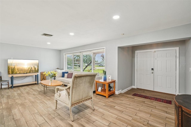 6010 Bayou Grande Blvd NE, Saint Petersburg, FL 33703 - living room featuring light wood-style floors and recessed lighting