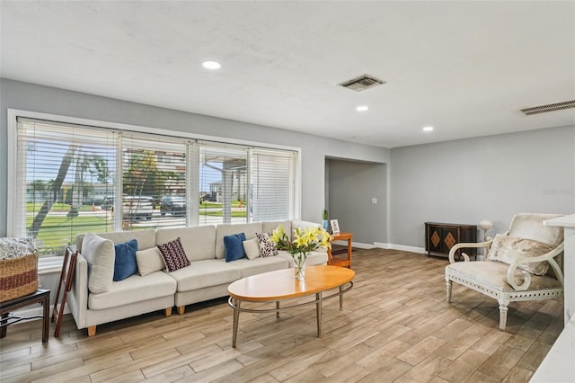 6010 Bayou Grande Blvd NE, Saint Petersburg, FL 33703 - living room featuring light wood finished floors and recessed lighting