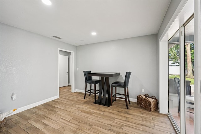 6010 Bayou Grande Blvd NE, Saint Petersburg, FL 33703 - dining room featuring light wood-style floors and recessed lighting