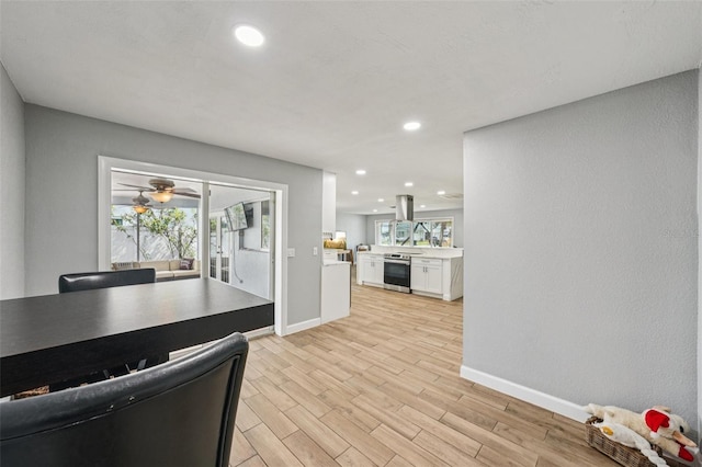 6010 Bayou Grande Blvd NE, Saint Petersburg, FL 33703 - kitchen featuring white cabinetry, light wood finished floors, recessed lighting, light countertops, and ceiling fan
