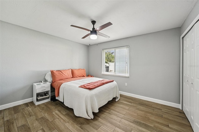 6010 Bayou Grande Blvd NE, Saint Petersburg, FL 33703 - bedroom featuring a closet, wood finished floors, and a ceiling fan