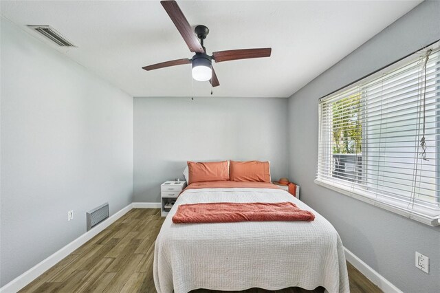 6010 Bayou Grande Blvd NE, Saint Petersburg, FL 33703 - bedroom featuring wood finished floors and a ceiling fan