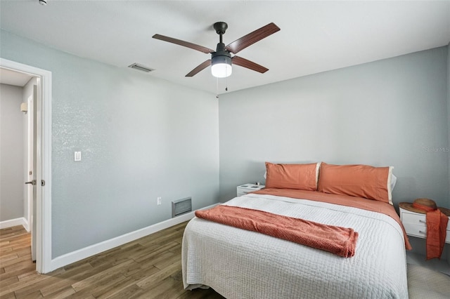 6010 Bayou Grande Blvd NE, Saint Petersburg, FL 33703 - bedroom featuring wood finished floors and a ceiling fan