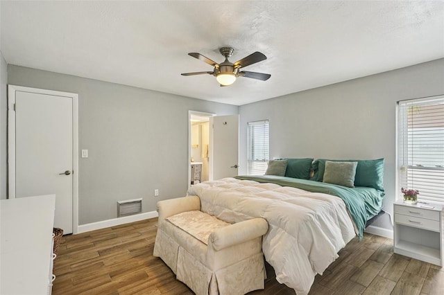 6010 Bayou Grande Blvd NE, Saint Petersburg, FL 33703 - bedroom with wood finished floors, ceiling fan, and ensuite bathroom