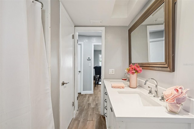 6010 Bayou Grande Blvd NE, Saint Petersburg, FL 33703 - full bathroom with wood finished floors, vanity, and curtained shower