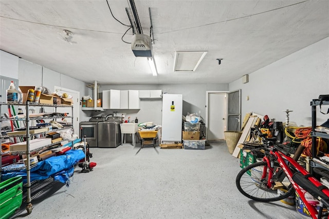 6010 Bayou Grande Blvd NE, Saint Petersburg, FL 33703 - garage featuring separate washer and dryer, white refrigerator, and a garage door opener