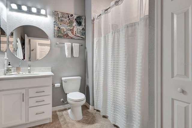 915 Tidewater Shores Loop, Bradenton, FL 34208 - full bathroom with toilet, tile patterned floors, a textured wall, vanity, and curtained shower