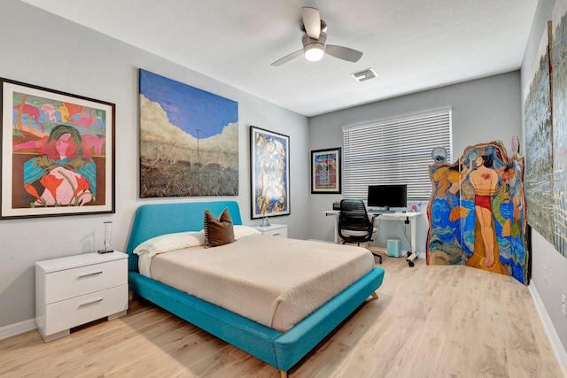 915 Tidewater Shores Loop, Bradenton, FL 34208 - bedroom featuring wood finished floors, baseboards, an office area, and a ceiling fan