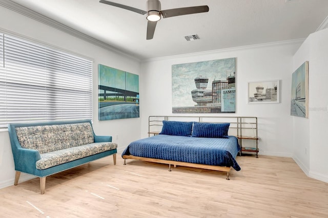 915 Tidewater Shores Loop, Bradenton, FL 34208 - bedroom featuring crown molding, wood finished floors, baseboards, and ceiling fan