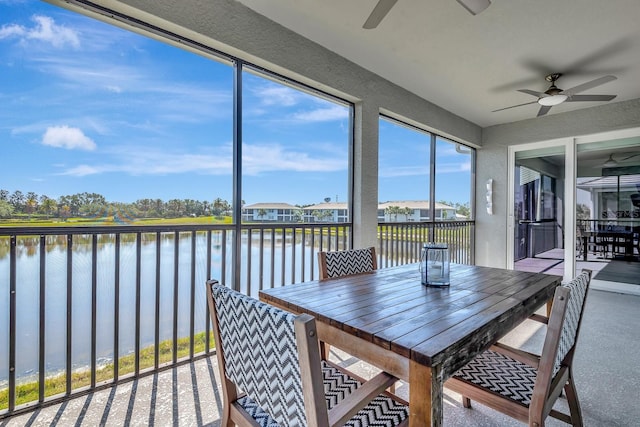 915 Tidewater Shores Loop, Bradenton, FL 34208 - sunroom featuring a water view and a textured wall