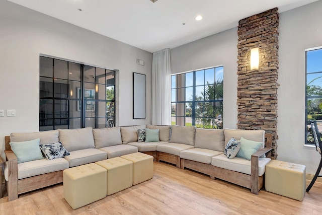 915 Tidewater Shores Loop, Bradenton, FL 34208 - living room featuring light wood-style flooring and healthy amount of natural light