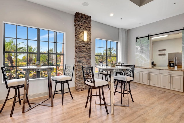 915 Tidewater Shores Loop, Bradenton, FL 34208 - dining area featuring light wood finished floors and recessed lighting