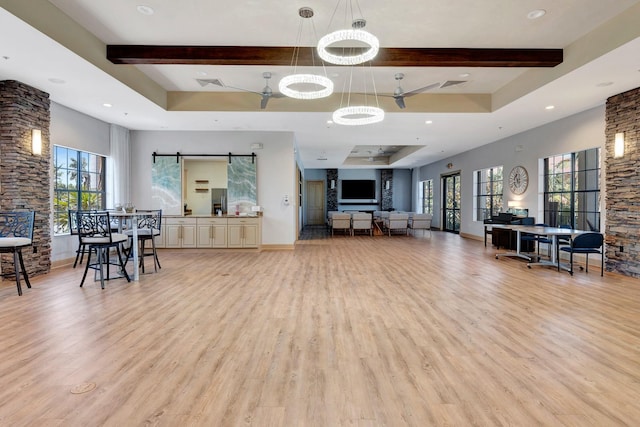 915 Tidewater Shores Loop, Bradenton, FL 34208 - living room with light wood-style floors, beamed ceiling, healthy amount of natural light, baseboards, and recessed lighting