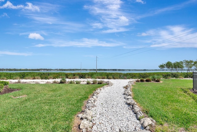 915 Tidewater Shores Loop, Bradenton, FL 34208 - view of community featuring a water view and a lawn