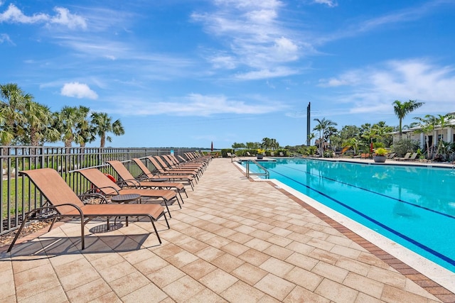 915 Tidewater Shores Loop, Bradenton, FL 34208 - community pool with a patio and fence