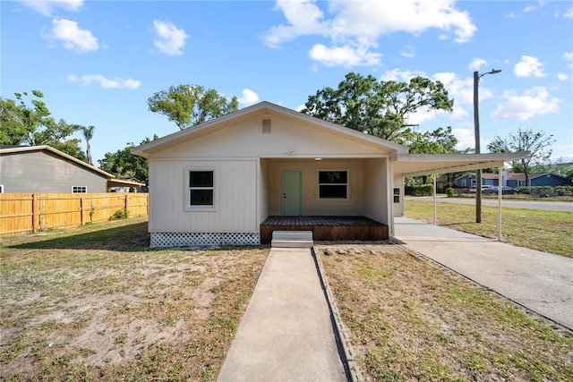 1108 E Annie St, Tampa, FL 33612 - view of front of house with a carport and concrete driveway