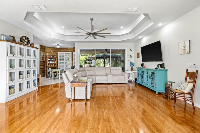 5296 Slater Rd, Spring Hill, FL 34608 - living area featuring a raised ceiling, light wood-style flooring, a ceiling fan, and recessed lighting