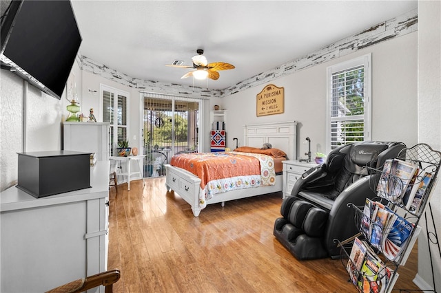 5296 Slater Rd, Spring Hill, FL 34608 - bedroom with access to outside, multiple windows, light wood-type flooring, and ceiling fan