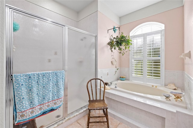 5296 Slater Rd, Spring Hill, FL 34608 - bathroom featuring healthy amount of natural light, a stall shower, and a garden tub