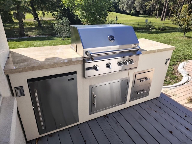 5296 Slater Rd, Spring Hill, FL 34608 - view of patio / terrace featuring a wooden deck and exterior kitchen