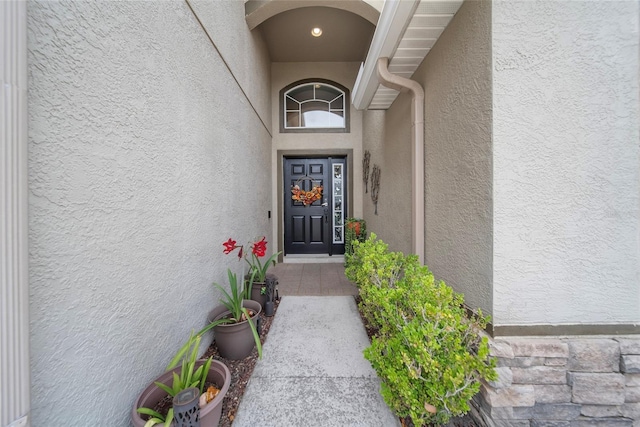 35819 Diamond Head Ct, Zephyrhills, FL 33541 - doorway to property with stucco siding and stone siding