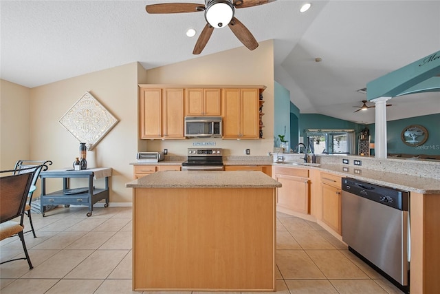 35819 Diamond Head Ct, Zephyrhills, FL 33541 - kitchen with stainless steel appliances, a ceiling fan, light brown cabinetry, lofted ceiling, and light tile patterned floors