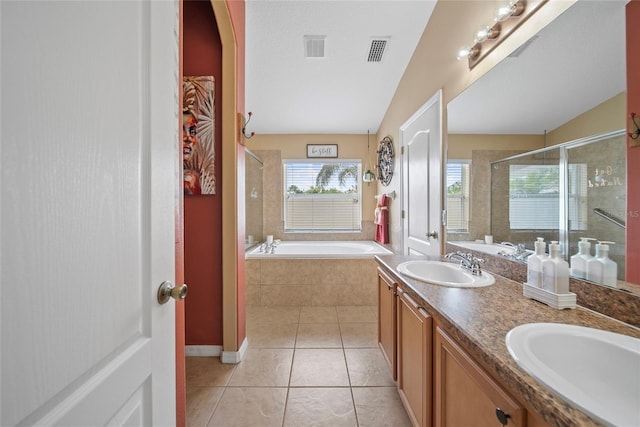 35819 Diamond Head Ct, Zephyrhills, FL 33541 - bathroom featuring a stall shower, tile patterned flooring, a garden tub, and double vanity