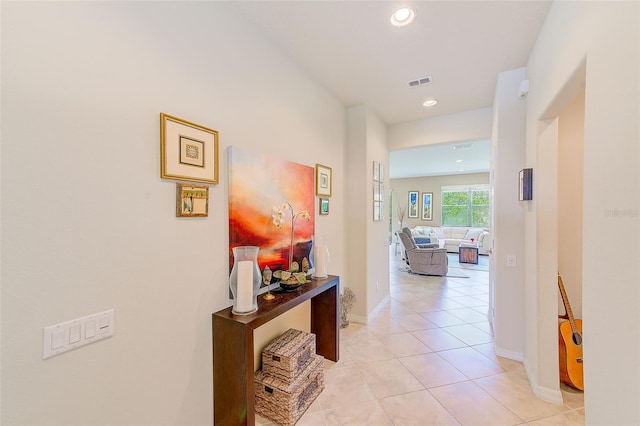hallway with light tile patterned flooring, recessed lighting, and baseboards