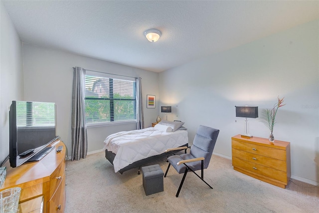 bedroom featuring carpet flooring and baseboards
