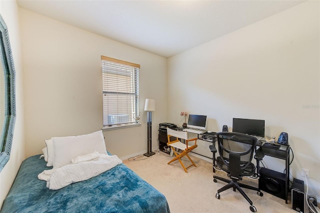bedroom with a desk, carpet, and baseboards
