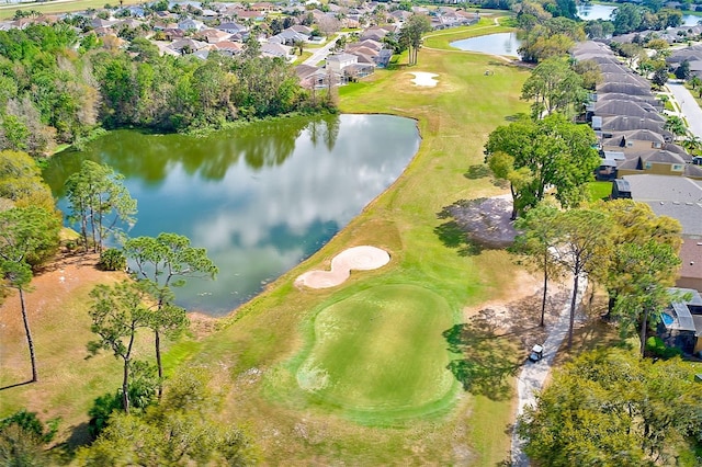 aerial overview of property's location with nearby suburban area, a nearby body of water, and a golf club