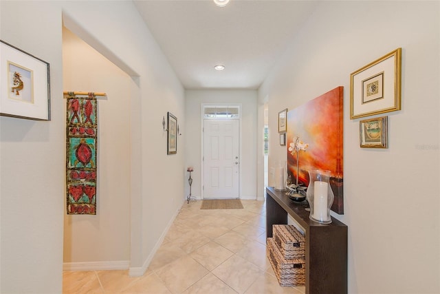 entryway featuring light tile patterned flooring, baseboards, and recessed lighting