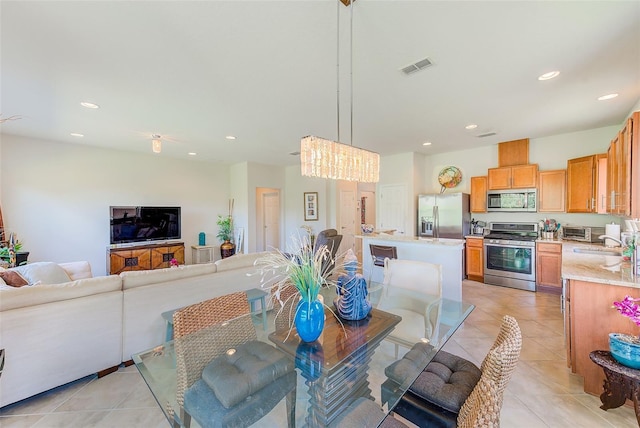 dining space featuring light tile patterned flooring and recessed lighting