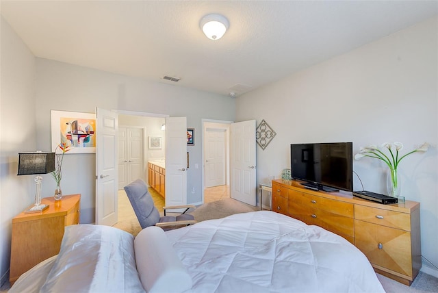 bedroom featuring light carpet and baseboards