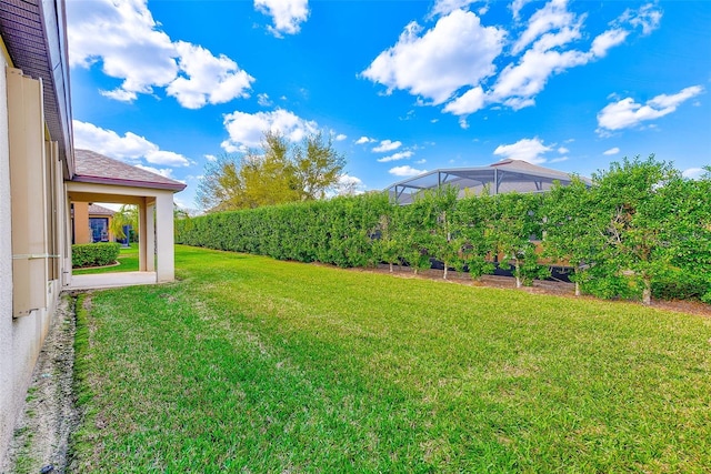 view of green lawn with a vegetable garden