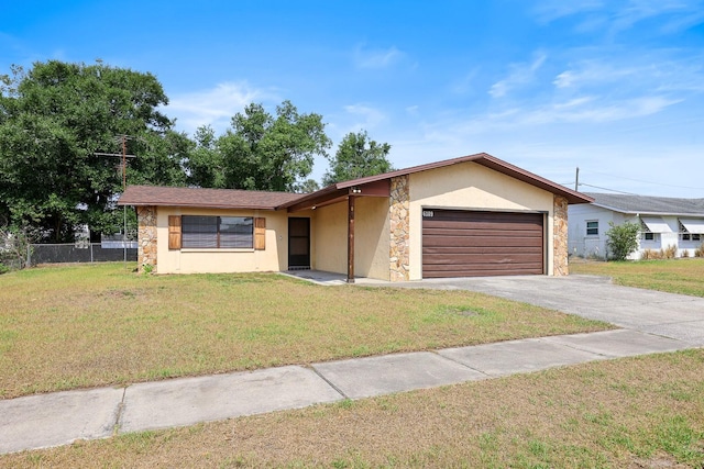 view of front facade featuring stucco siding, stone siding, a garage, and asphalt driveway