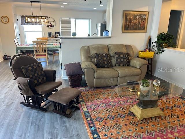 living room featuring wood finished floors and baseboards