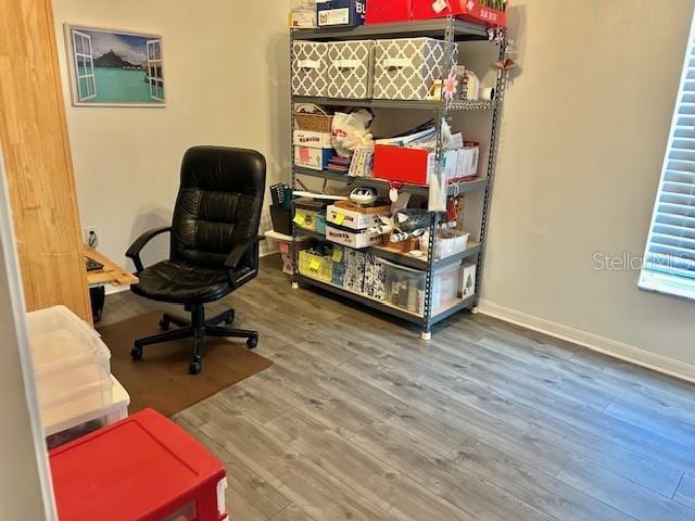 office featuring wood finished floors and baseboards