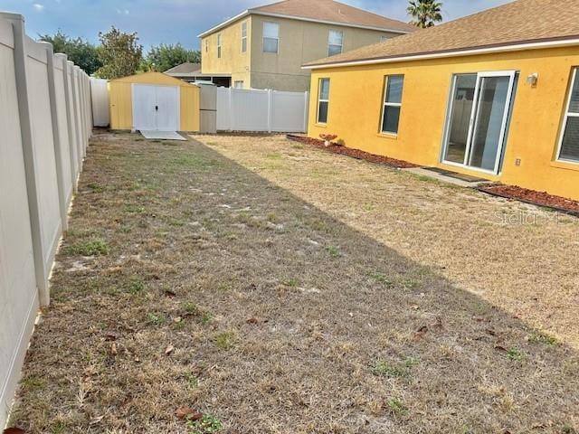 view of yard with a shed and an outdoor structure