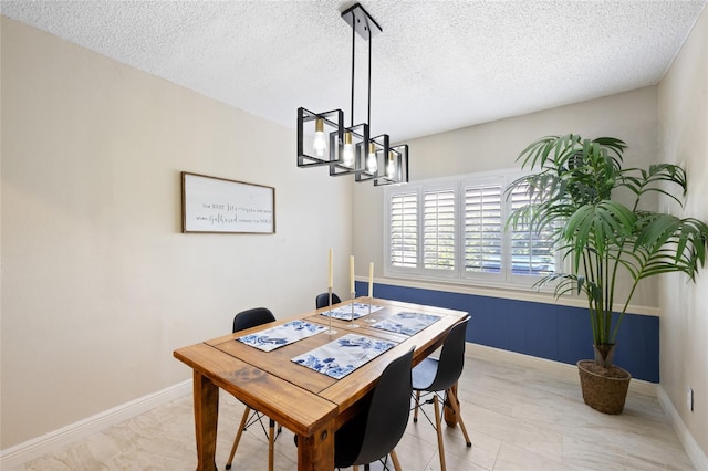 916 Shangri La Dr, Seffner, FL 33584 - dining space with a chandelier, a textured ceiling, and baseboards